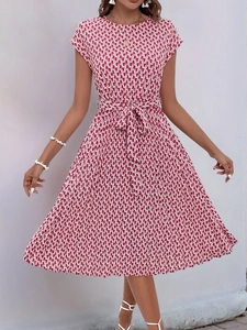 Detail of red and white geometric print dress with short sleeves and waist tie design