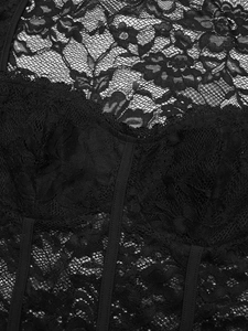 Detail of floral lace texture and vertical boning on this black long sleeve bodysuit