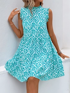 Detail of ruffle neck and blue geometric print on sleeveless tiered summer dress