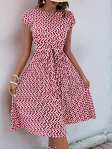 Detail of red and white geometric print dress with short sleeves and waist tie belt