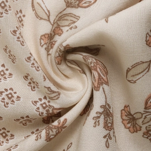 Close-up of printed ethnic fabric with geometric patterns and soft linen texture