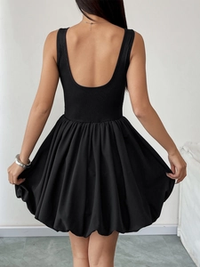 Detailed back view of a black backless mini dress with ribbed top and bubble skirt