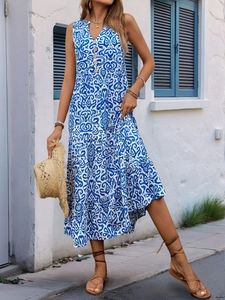 Detail of blue boho print sleeveless V-neck maxi dress with tiered skirt design