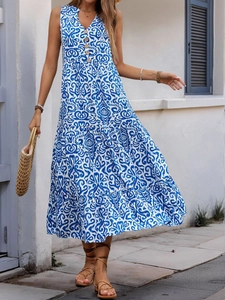 Detail of tiered sleeveless V-neck maxi dress with vintage paisley print and wooden buttons
