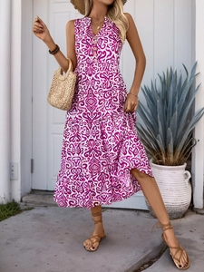 Detail of V-neck sleeveless paisley maxi dress with wooden buttons and tiered skirt design