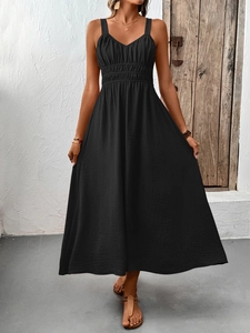 Detailed view of the smocked waist and textured fabric on the black sleeveless maxi dress