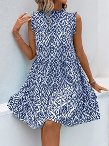 Detail of bohemian blue and white ikat print sleeveless tiered vacation dress