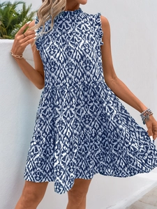 Detail of blue and white geometric print sleeveless dress with ruffled collar and tiered skirt