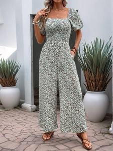 Close-up of smocked bodice and square neckline on floral wide-leg jumpsuit