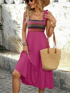 Detail of bohemian embroidery and adjustable bow straps on a rose pink summer maxi dress