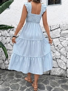 Detail of the smocked back and ruffled straps on this blue striped tiered midi dress