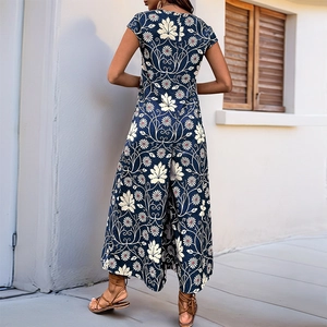 Bohemian floral wide-leg jumpsuit with short sleeves and leaf print on navy blue fabric