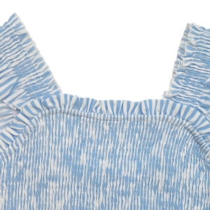Detail of blue and white striped summer dress with elastic smocking and ruffle trim