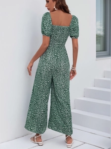 Detail of square neck and shirred elastic back on dark green floral wide leg jumpsuit