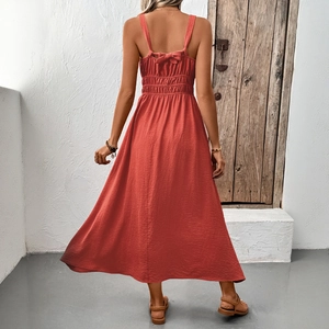 Brick red sleeveless backless maxi dress with textured fabric and bow-tie waist
