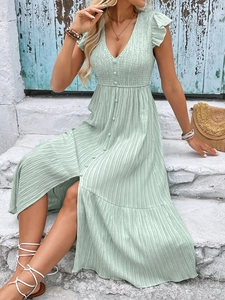 Detail of light green V-neck sleeveless maxi dress with smocked bodice and button front
