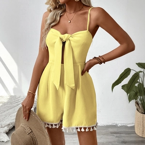 Yellow waffle textured playsuit with bow and tassel hem for summer resort style