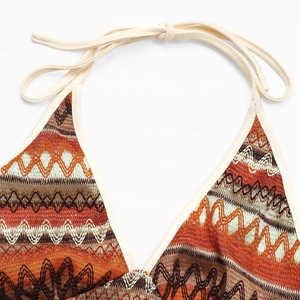 Detail of knitted halter top with colorful chevron pattern and beige neck tie string