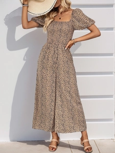 Detail of square neck romper with puff sleeves and leopard print for summer vacation