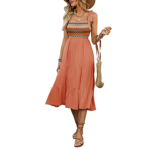 Bohemian orange summer midi dress with adjustable straps and tiered geometric pattern