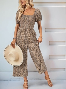 Detail view of square neck leopard print jumpsuit with puff sleeves and smocked bodice