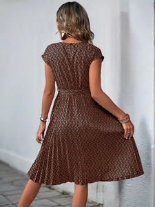 Close-up back view of a summer maxi dress with geometric snake print and zipper