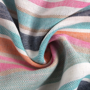 Detailed macro view of colorful striped knit fabric texture with vibrant rainbow patterns