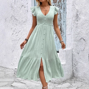 Light green V-neck midi dress with ruffled sleeves and textured fabric in outdoor setting