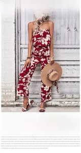Detail of red floral print off-shoulder wide-leg jumpsuit for a summer holiday look