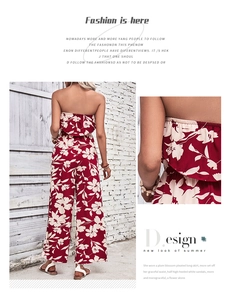 Detailed view of red floral jumpsuit featuring off-the-shoulder design and wide leg cut
