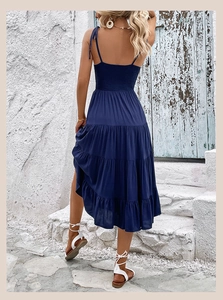 Close-up of shirred elastic back and tiered ruffle layers of navy blue summer A-line dress