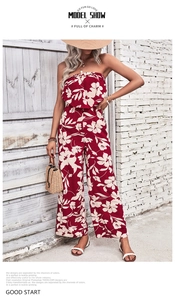 Detail of red floral off-the-shoulder wide leg jumpsuit with summery printed patterns