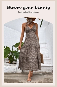 Detail of V-neck tiered maxi dress with geometric print and layered ruffle hemline