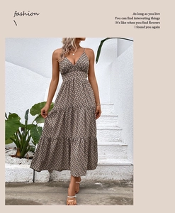 Detail of V-neck tiered sun dress with geometric print and thin spaghetti straps