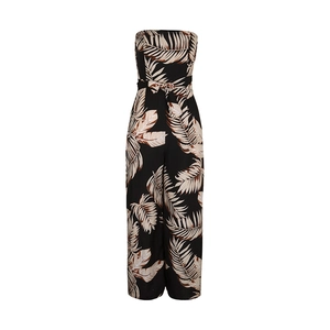 Detail of tropical leaf print tube top jumpsuit with matching waist belt and wide leg cut