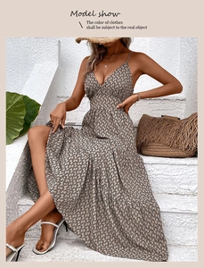 Close-up of summer halter maxi dress with snake skin print and tiered skirt layers