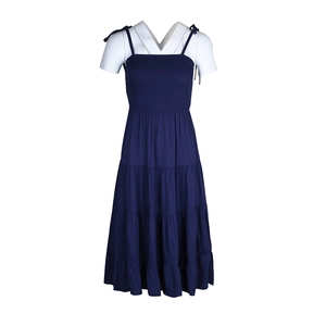 Detail of dark blue tiered midi dress with smocked bodice and adjustable tie straps