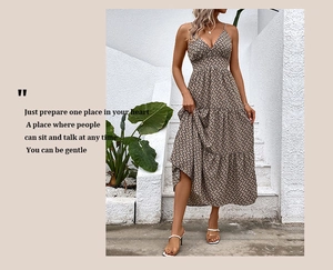 Detail view of a V-neck tiered floral maxi dress with geometric print for summer