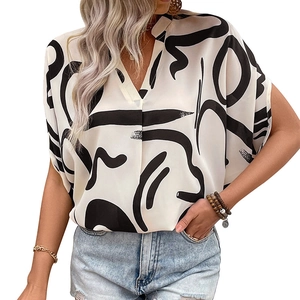Women's batwing sleeve V-neck blouse featuring black abstract geometric patterns