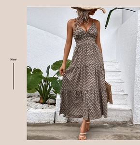 Detail of bohemian halter maxi dress featuring deep V-neck and geometric chain print