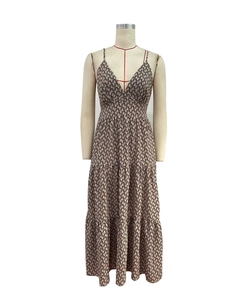 Detail of V-neck summer maxi dress featuring geometric link print and tiered cake skirt layers