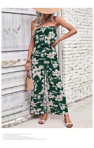 Detail of tropical floral print on a strapless wide-leg jumpsuit for women's summer style