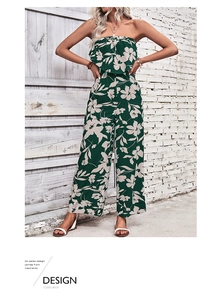 Detail of floral print on dark green off-shoulder wide leg jumpsuit with waist tie
