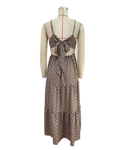 Detail view of backless summer maxi dress with large bow knot and tiered bohemian skirt