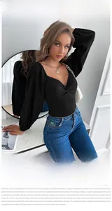 Detail of elegant black long sleeve bodysuit with V-neck knot and stylish puff sleeves