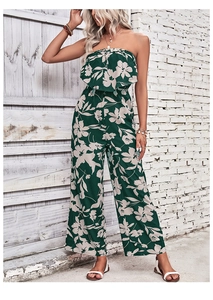 Detail of summer tube top jumpsuit with white floral print and flowing wide leg cut