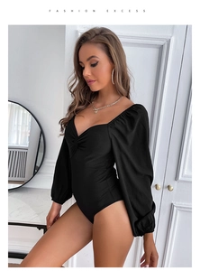 Detail of French-style black long sleeve bodysuit with sweetheart neckline and front knot