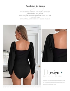 Detail of black ribbed long sleeve bodysuit featuring puff shoulders and vintage square neck