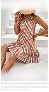 Halter neck summer dress with colorful diagonal stripes and ruffled hem for vacation wear