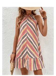 Detail of colorful striped halter dress featuring ruffled hem and vibrant summer textures